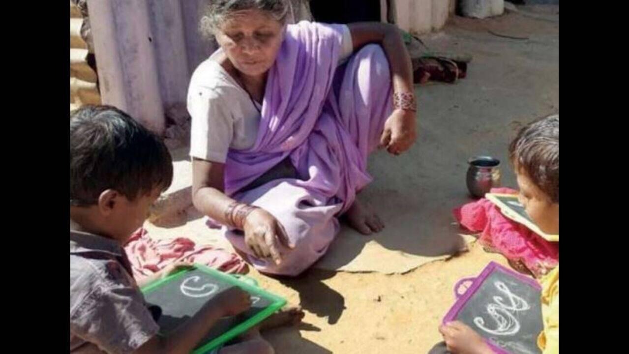 Grandmother Teaching Children to Write Letters in Sand Goes Viral, Winning Hearts With a Traditional Learning Method